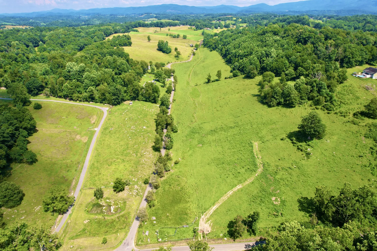 Aerial view of green rolling acreage and development lots in Chilhowie, Virginia